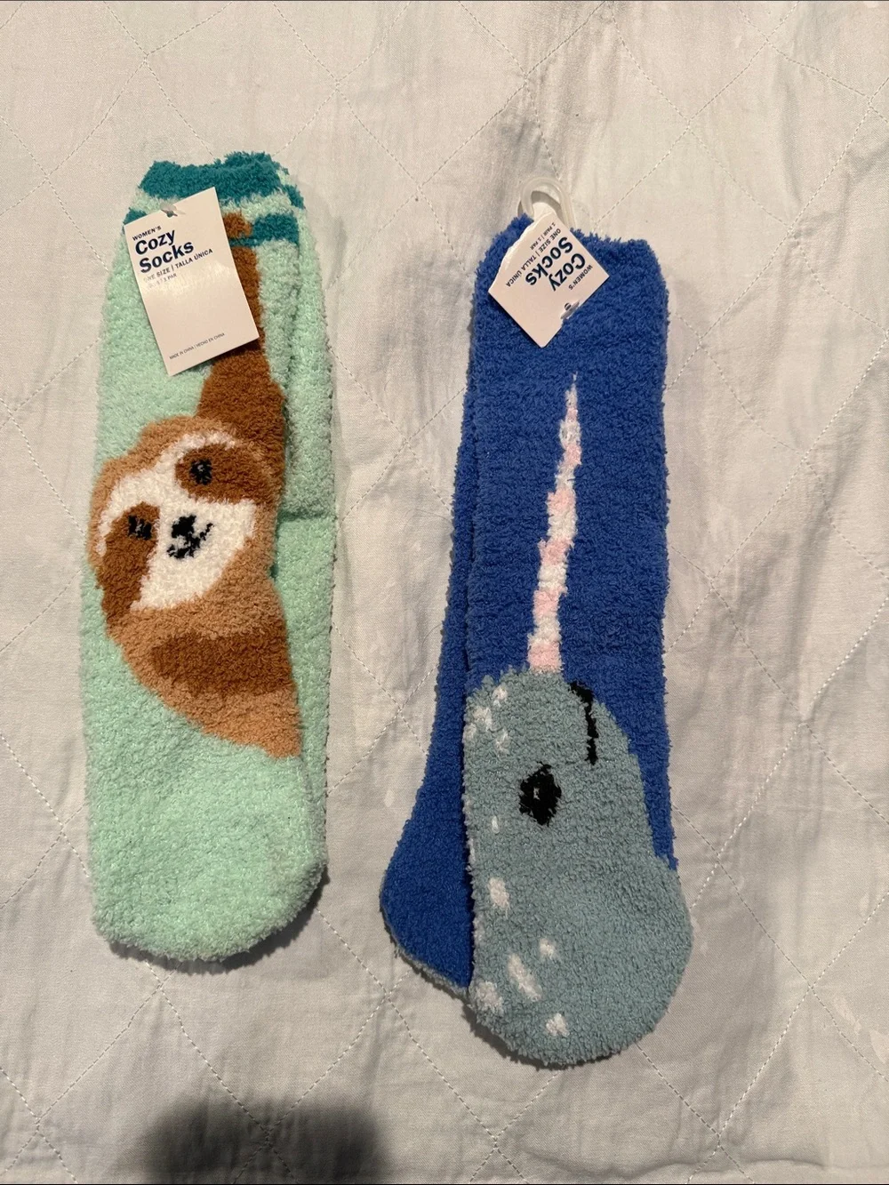 Sloth and Narwhal cozy socks